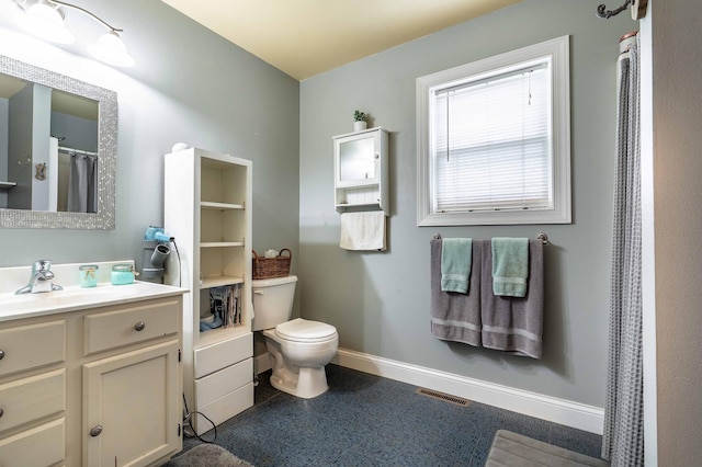29560 204th Ave, Elizabeth Twp, MN 56537 - bathroom featuring vanity, baseboards, and toilet