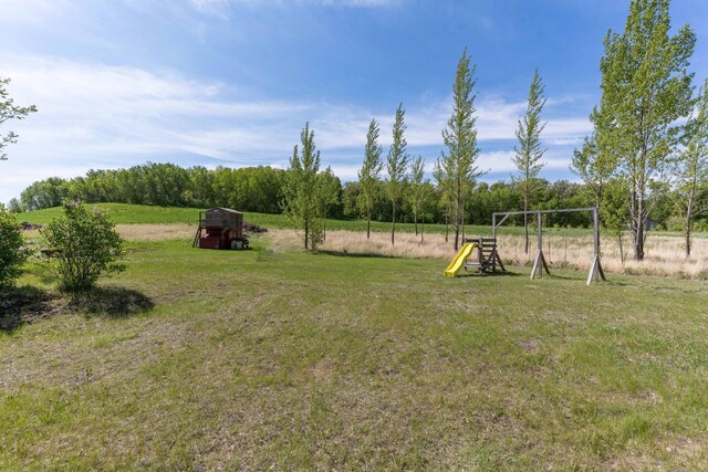 29560 204th Ave, Elizabeth Twp, MN 56537 - view of green lawn featuring a playground and a rural view