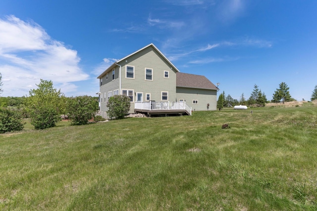 29560 204th Ave, Elizabeth Twp, MN 56537 - rear view of house with a wooden deck and a lawn