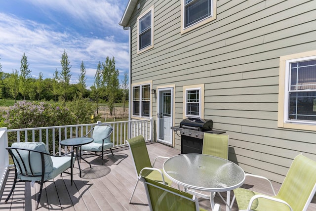29560 204th Ave, Elizabeth Twp, MN 56537 - wooden terrace featuring grilling area and outdoor dining area