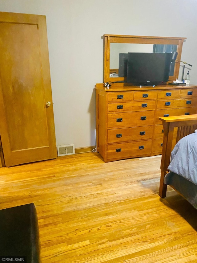 bedroom with light wood-type flooring
