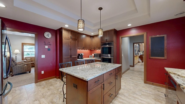 380 7th St SE, Chatfield, MN 55923 - kitchen with a raised ceiling, stainless steel appliances, recessed lighting, baseboards, and a kitchen island