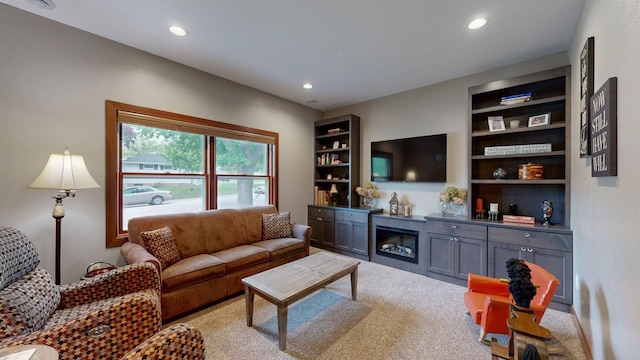 380 7th St SE, Chatfield, MN 55923 - living room featuring light colored carpet, recessed lighting, and built in shelves