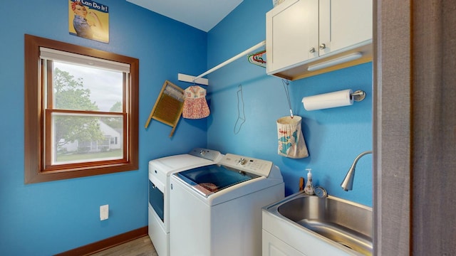 380 7th St SE, Chatfield, MN 55923 - laundry area featuring cabinet space, separate washer and dryer, and wood finished floors