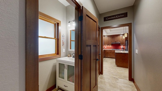 380 7th St SE, Chatfield, MN 55923 - hallway featuring a textured wall and baseboards