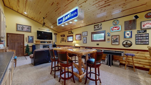 380 7th St SE, Chatfield, MN 55923 - rec room with wood ceiling, a fireplace, light carpet, and vaulted ceiling