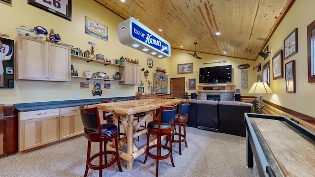 380 7th St SE, Chatfield, MN 55923 - kitchen with wood ceiling, light carpet, recessed lighting, a fireplace, and a ceiling fan