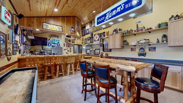 380 7th St SE, Chatfield, MN 55923 - indoor bar featuring wood ceiling, light colored carpet, recessed lighting, high vaulted ceiling, and wood walls