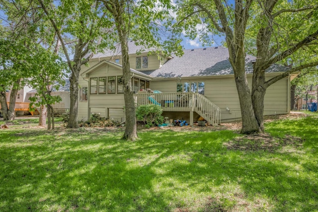14994 Crane St NW, Andover, MN 55304 - rear view of property featuring a deck, stairs, a lawn, and roof with shingles