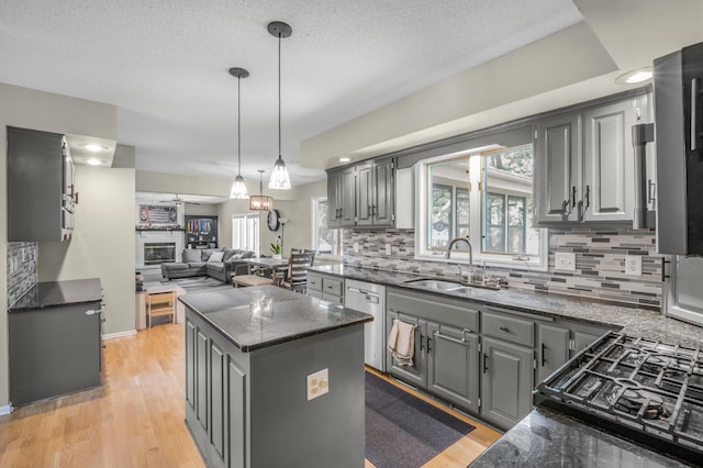 14994 Crane St NW, Andover, MN 55304 - kitchen featuring gray cabinetry, stainless steel dishwasher, open floor plan, healthy amount of natural light, and recessed lighting