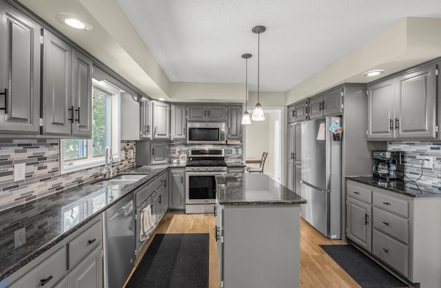 14994 Crane St NW, Andover, MN 55304 - kitchen with stainless steel appliances, gray cabinets, tasteful backsplash, and recessed lighting
