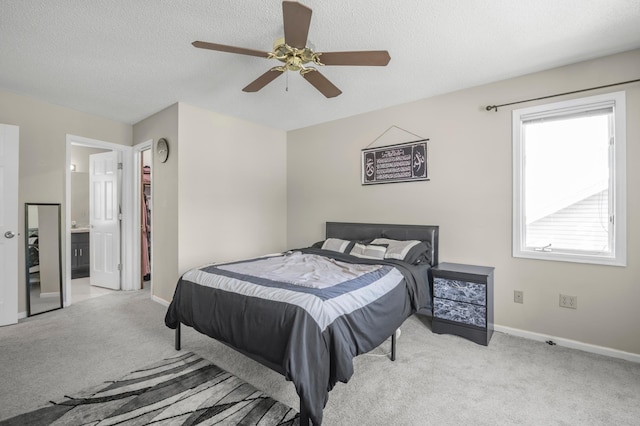 14994 Crane St NW, Andover, MN 55304 - carpeted bedroom with a textured ceiling, a ceiling fan, and ensuite bathroom
