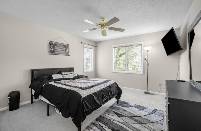 14994 Crane St NW, Andover, MN 55304 - bedroom with light colored carpet, a textured ceiling, and a ceiling fan