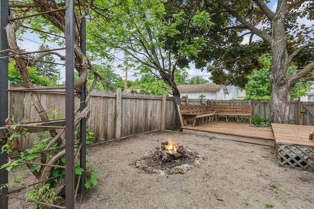 4207 Vincent Ave, Minneapolis, MN 55412 - fenced backyard with an outdoor fire pit and a wooden deck