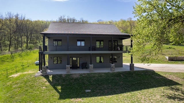 29572 Morgan Rd, Wykoff, MN 55990 - rear view of house with a balcony and a patio area