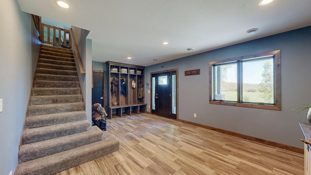 29572 Morgan Rd, Wykoff, MN 55990 - foyer featuring stairs, recessed lighting, baseboards, and light wood-style floors