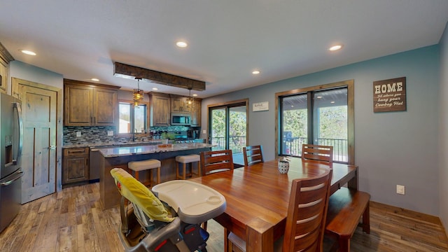 29572 Morgan Rd, Wykoff, MN 55990 - dining room featuring healthy amount of natural light, wood finished floors, and recessed lighting