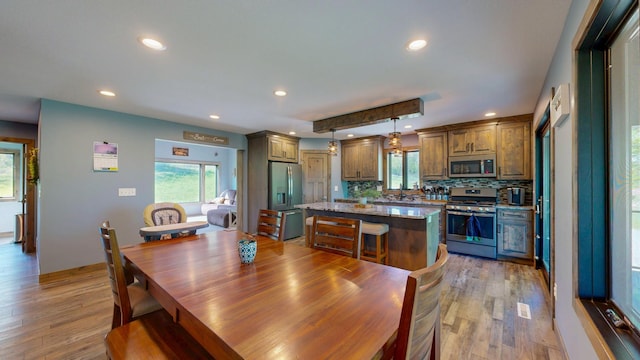 29572 Morgan Rd, Wykoff, MN 55990 - dining area featuring recessed lighting, light wood-type flooring, and healthy amount of natural light