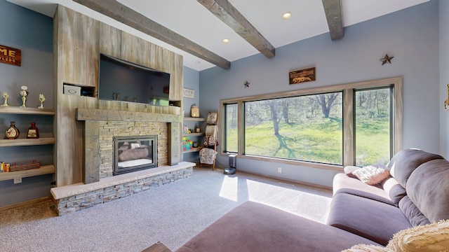29572 Morgan Rd, Wykoff, MN 55990 - carpeted living area with beam ceiling, healthy amount of natural light, a stone fireplace, and baseboards