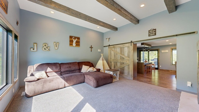 29572 Morgan Rd, Wykoff, MN 55990 - carpeted living room with a barn door, recessed lighting, beam ceiling, and baseboards