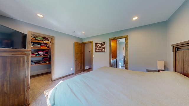 29572 Morgan Rd, Wykoff, MN 55990 - carpeted bedroom with a walk in closet, recessed lighting, baseboards, a closet, and connected bathroom
