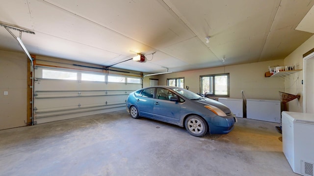 29572 Morgan Rd, Wykoff, MN 55990 - garage with fridge and a garage door opener