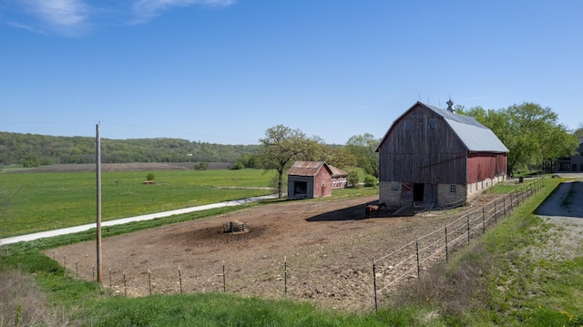 29572 Morgan Rd, Wykoff, MN 55990 - view of green lawn with a barn, an outbuilding, driveway, and a rural view