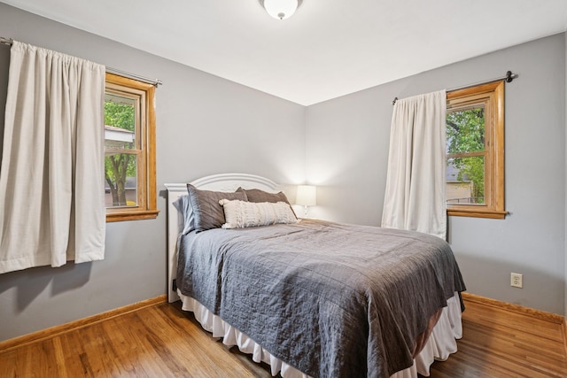 621 Irving Ave NW, Elk River, MN 55330 - bedroom with wood finished floors and baseboards