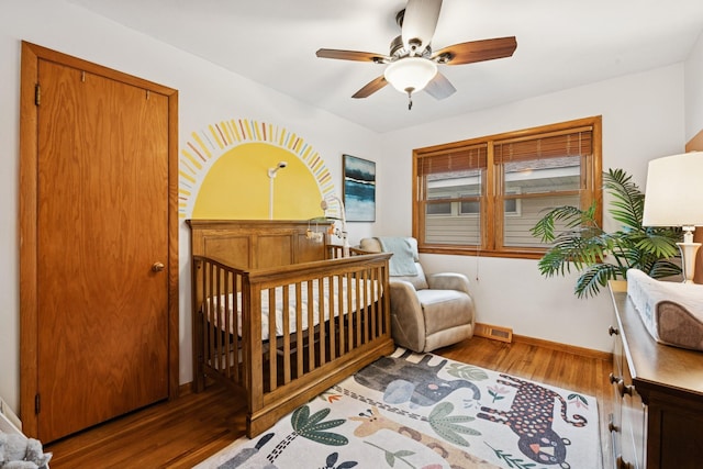 621 Irving Ave NW, Elk River, MN 55330 - bedroom with wood finished floors, baseboards, and ceiling fan