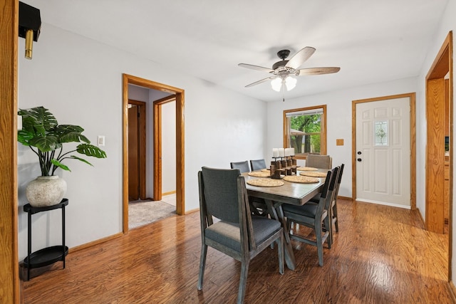 621 Irving Ave NW, Elk River, MN 55330 - dining space featuring wood finished floors, a ceiling fan, and baseboards