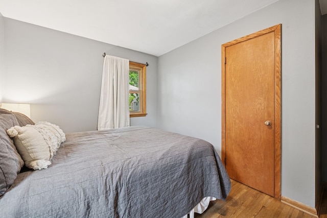 621 Irving Ave NW, Elk River, MN 55330 - bedroom with wood finished floors