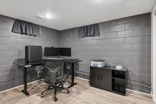 621 Irving Ave NW, Elk River, MN 55330 - office area featuring a textured ceiling, wood finished floors, and concrete block wall