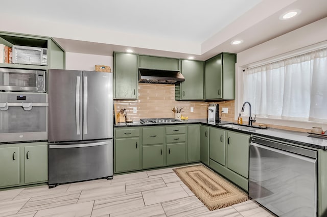1093 Smith Ave S, West Saint Paul, MN 55118 - kitchen featuring green cabinetry, appliances with stainless steel finishes, range hood, a sink, and dark countertops