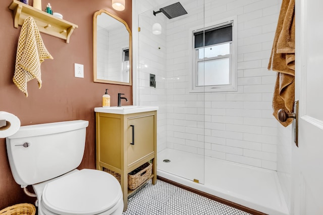 1093 Smith Ave S, West Saint Paul, MN 55118 - full bath featuring vanity, tiled shower, toilet, and tile patterned flooring