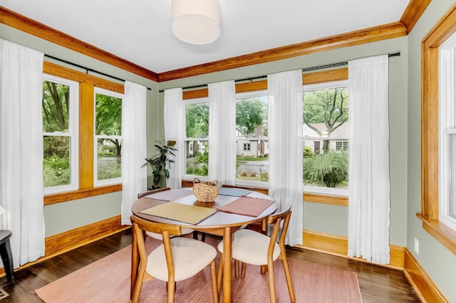 1093 Smith Ave S, West Saint Paul, MN 55118 - dining space featuring ornamental molding, dark wood finished floors, and baseboards