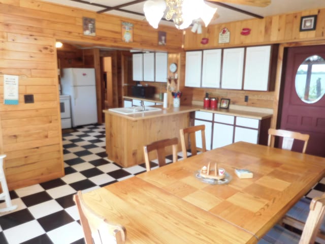 31649 250th Ave, Wendell, MN 56590 - dining room with light flooring, wood walls, and a ceiling fan