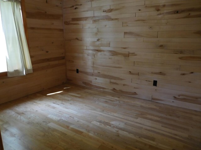 31649 250th Ave, Wendell, MN 56590 - empty room featuring hardwood / wood-style flooring, wooden walls, and a sauna