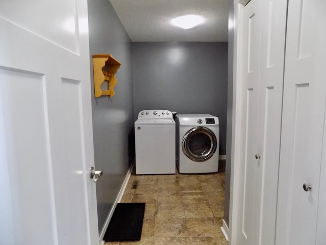 1173 Lone Stone Ct SE, Chatfield, MN 55923 - washroom with independent washer and dryer, baseboards, a textured ceiling, and stone finish floors
