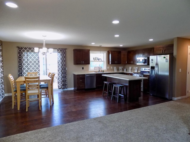 1173 Lone Stone Ct SE, Chatfield, MN 55923 - kitchen with stainless steel appliances, light countertops, a sink, a center island, and recessed lighting