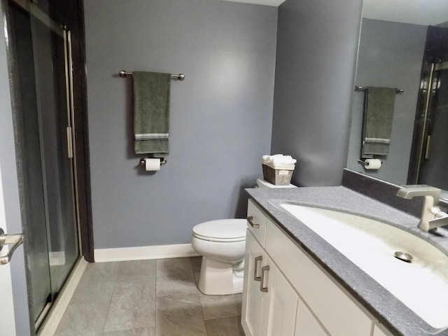 1173 Lone Stone Ct SE, Chatfield, MN 55923 - full bath featuring a stall shower, toilet, tile patterned flooring, vanity, and baseboards