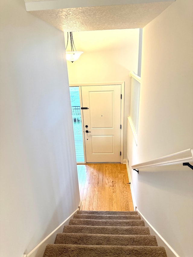 628 20th Ave S, Minneapolis, MN 55454 - stairway with wood finished floors and baseboards