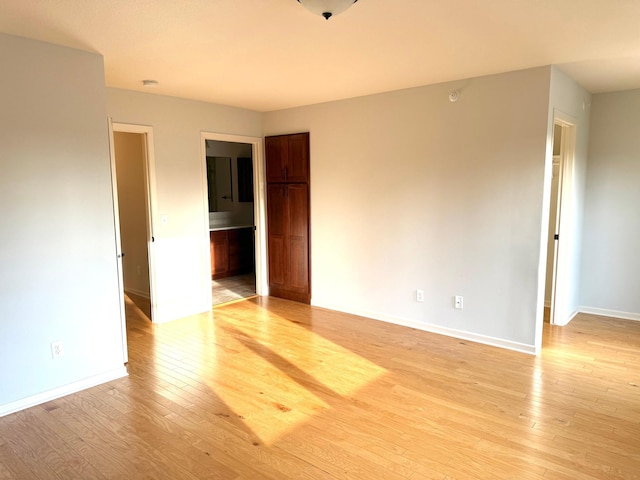 628 20th Ave S, Minneapolis, MN 55454 - empty room with light wood-style floors and baseboards