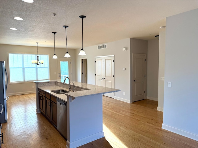 628 20th Ave S, Minneapolis, MN 55454 - kitchen featuring dishwasher, light wood-style flooring, a chandelier, and recessed lighting