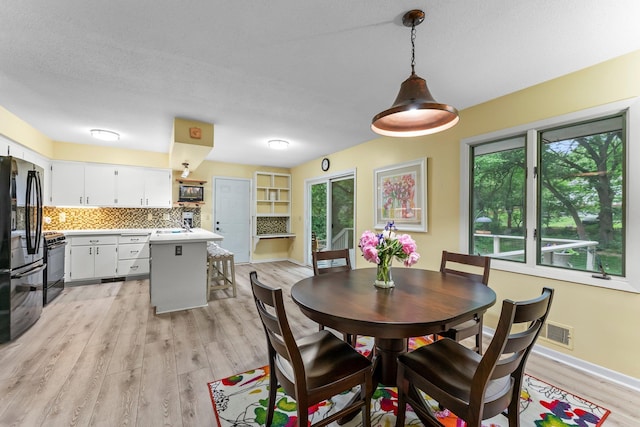 18520 29th Ave N, Plymouth, MN 55447 - dining space featuring light wood-style floors and baseboards