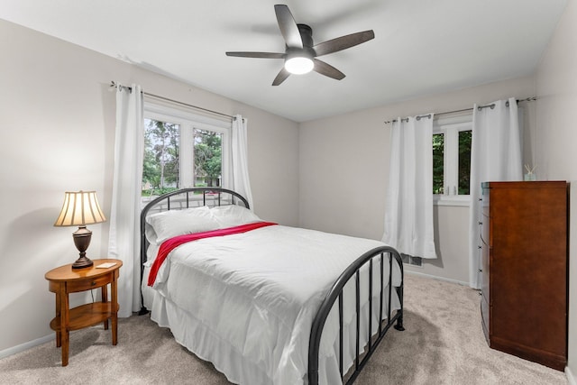 18520 29th Ave N, Plymouth, MN 55447 - bedroom featuring multiple windows, light carpet, and ceiling fan
