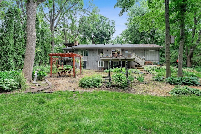 18520 29th Ave N, Plymouth, MN 55447 - rear view of house featuring a wooden deck, stairway, a chimney, and a yard