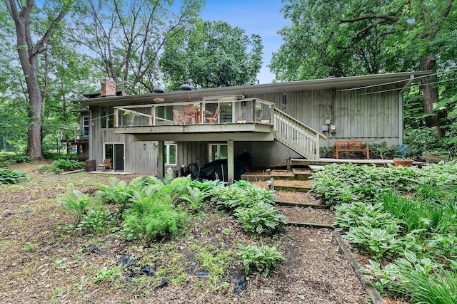 18520 29th Ave N, Plymouth, MN 55447 - rear view of property featuring a chimney, stairway, and a wooden deck