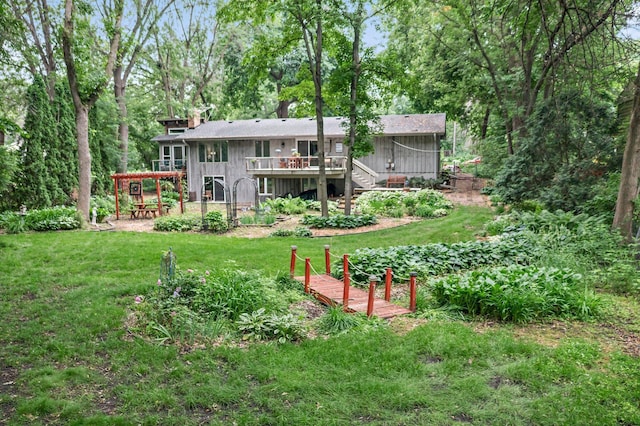 18520 29th Ave N, Plymouth, MN 55447 - back of house with a wooden deck, a yard, stairway, and board and batten siding