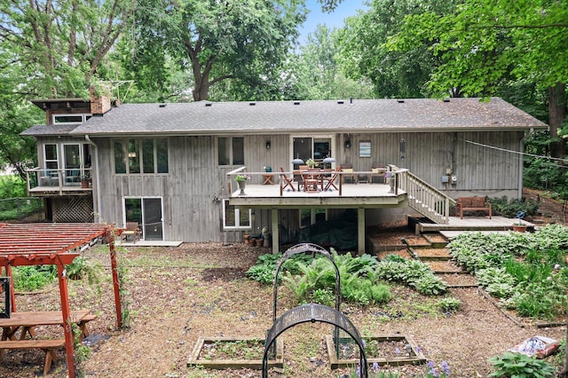18520 29th Ave N, Plymouth, MN 55447 - back of house with a deck, a chimney, stairs, and roof with shingles