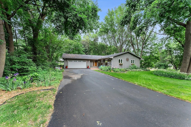 18520 29th Ave N, Plymouth, MN 55447 - view of front facade featuring driveway, a garage, and a front lawn